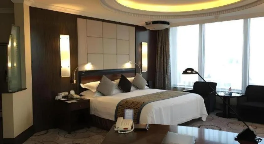 Bed in Grand Soluxe Zhongyou Hotel