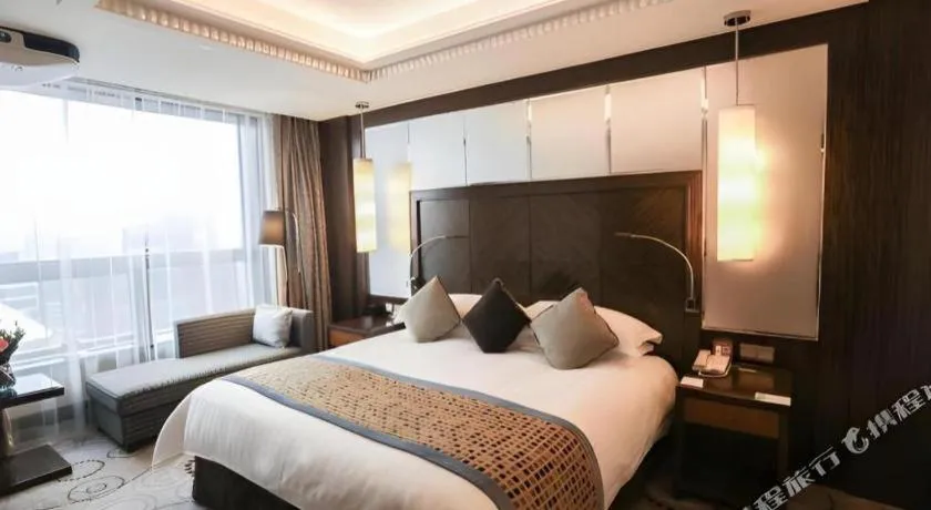 Bed in Grand Soluxe Zhongyou Hotel