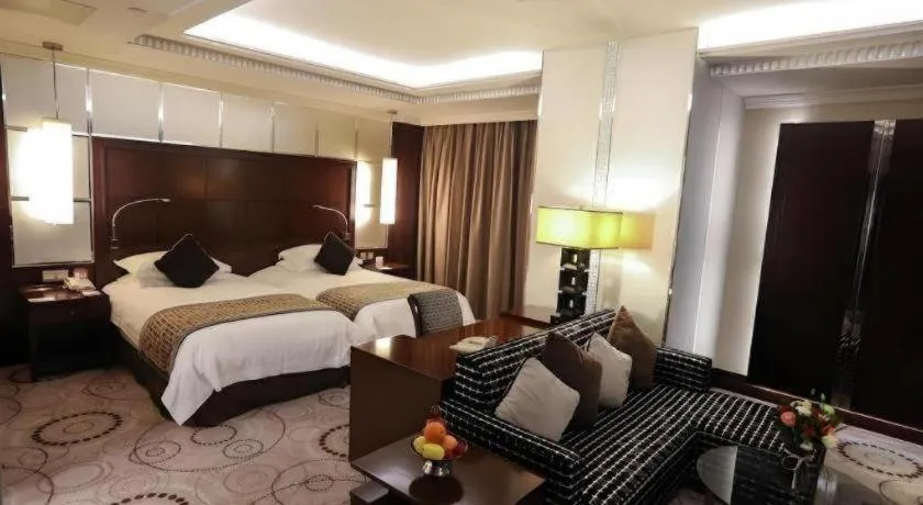 Bed in Grand Soluxe Zhongyou Hotel