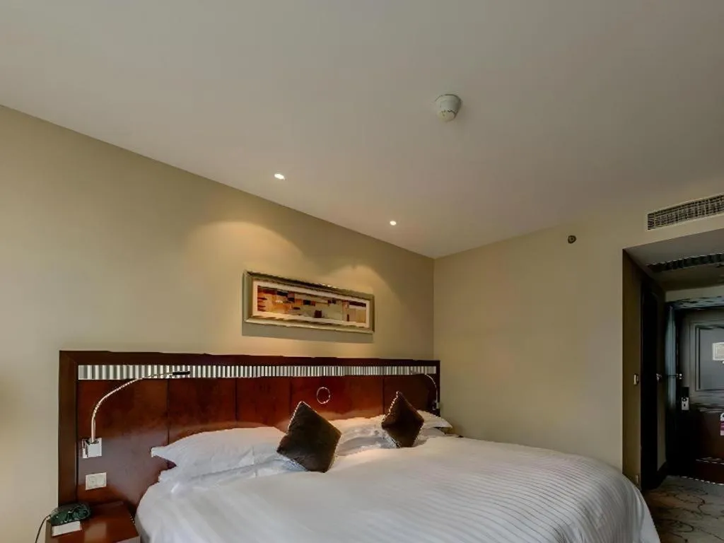 Bed in Grand Soluxe Zhongyou Hotel