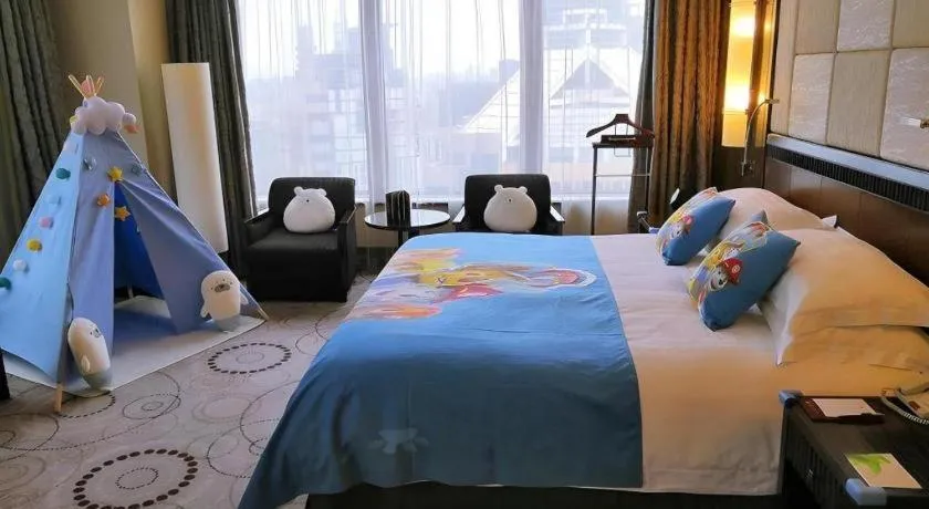 Bed in Grand Soluxe Zhongyou Hotel