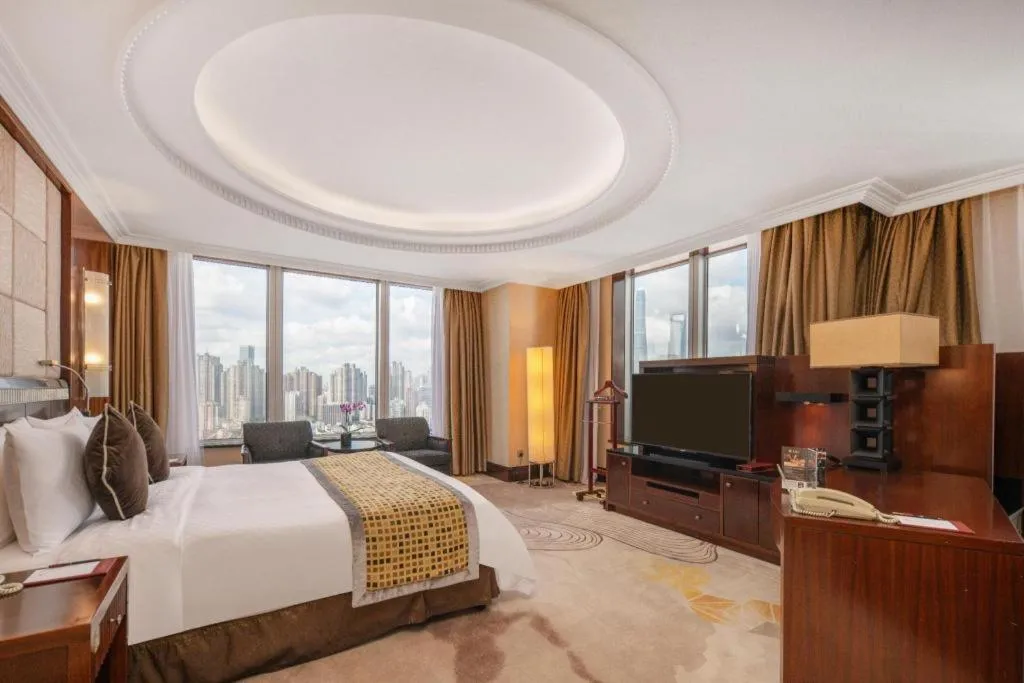 Bed in Grand Soluxe Zhongyou Hotel