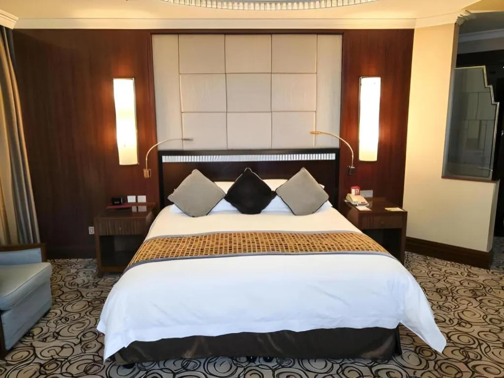 Bed in Grand Soluxe Zhongyou Hotel