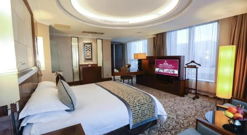 Bed in Grand Soluxe Zhongyou Hotel