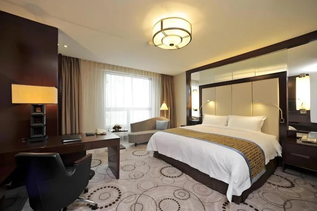 Bed in Grand Soluxe Zhongyou Hotel