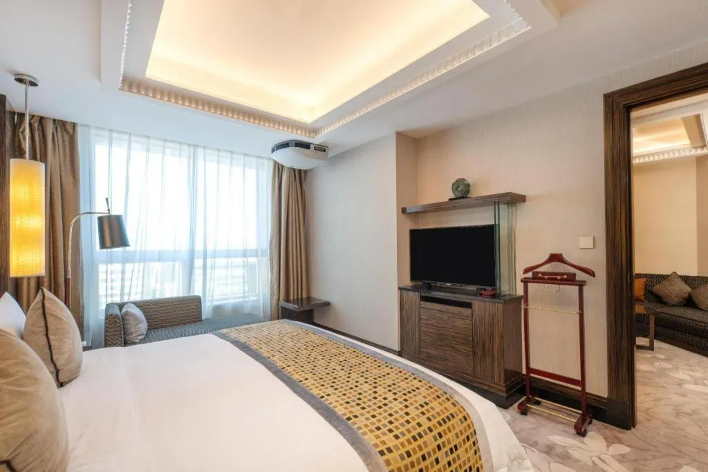 Bed in Grand Soluxe Zhongyou Hotel