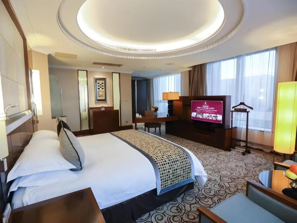 Bed in Grand Soluxe Zhongyou Hotel