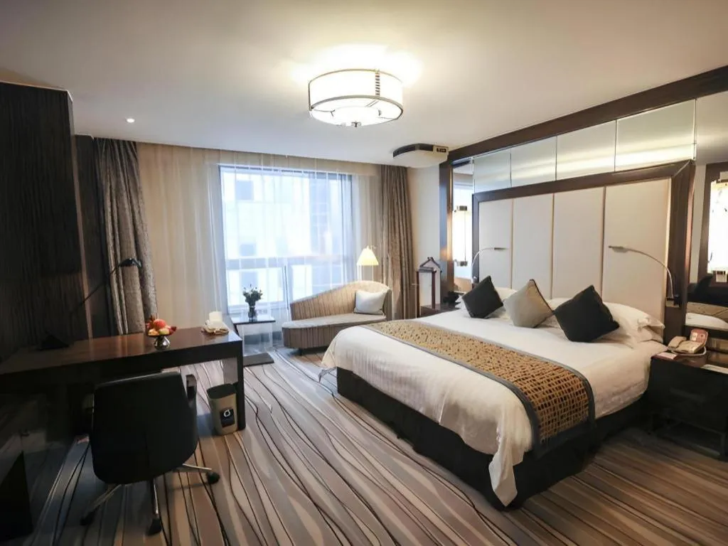 Bed in Grand Soluxe Zhongyou Hotel