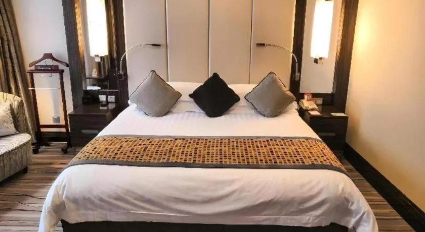 Bed in Grand Soluxe Zhongyou Hotel