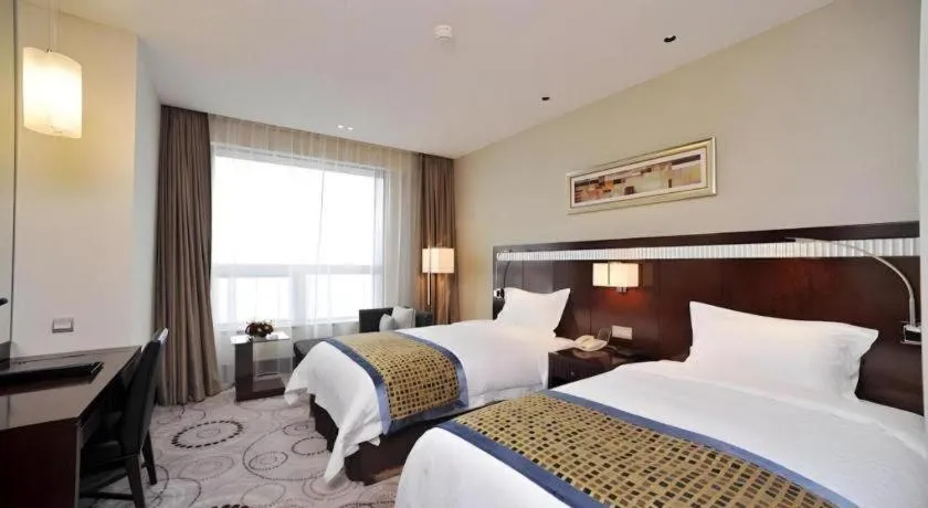 Bed in Grand Soluxe Zhongyou Hotel