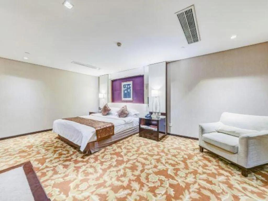 Bed in West International Trade Grand Hotel