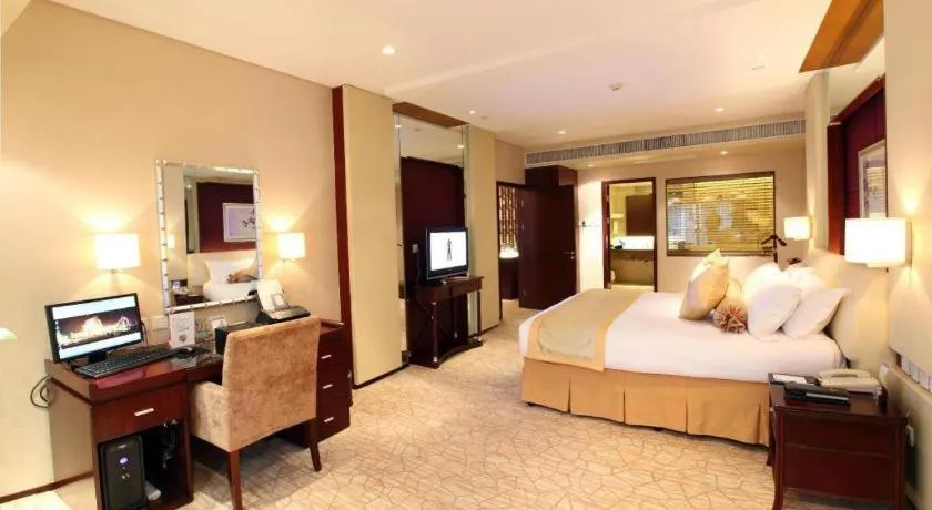 Bed in West International Trade Grand Hotel