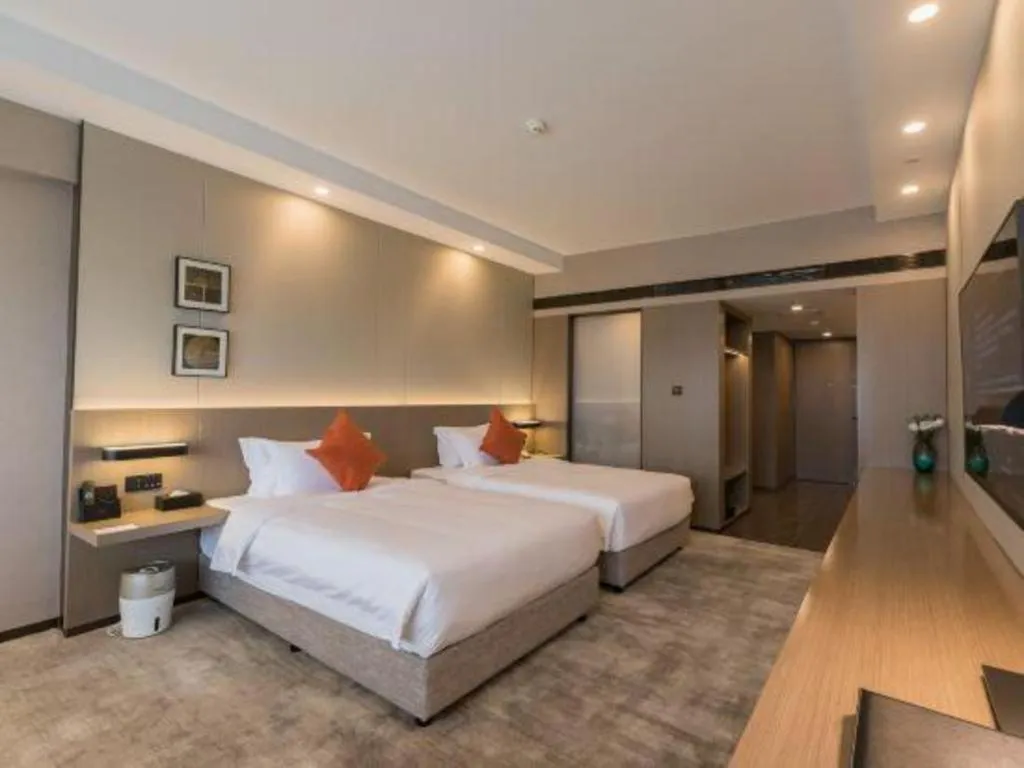 Bed in West International Trade Grand Hotel