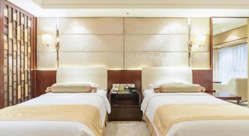 Bed in West International Trade Grand Hotel