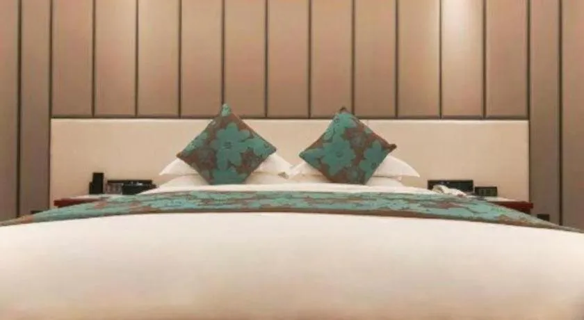 Bed in West International Trade Grand Hotel