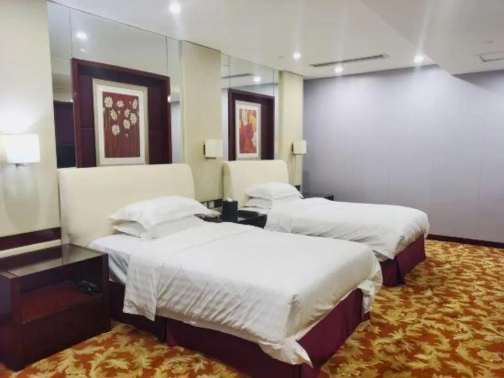 Bed in West International Trade Grand Hotel