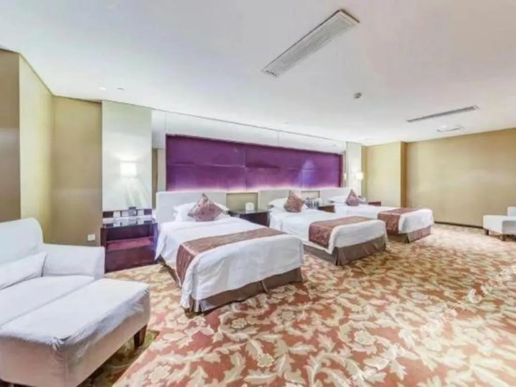 Bed in West International Trade Grand Hotel