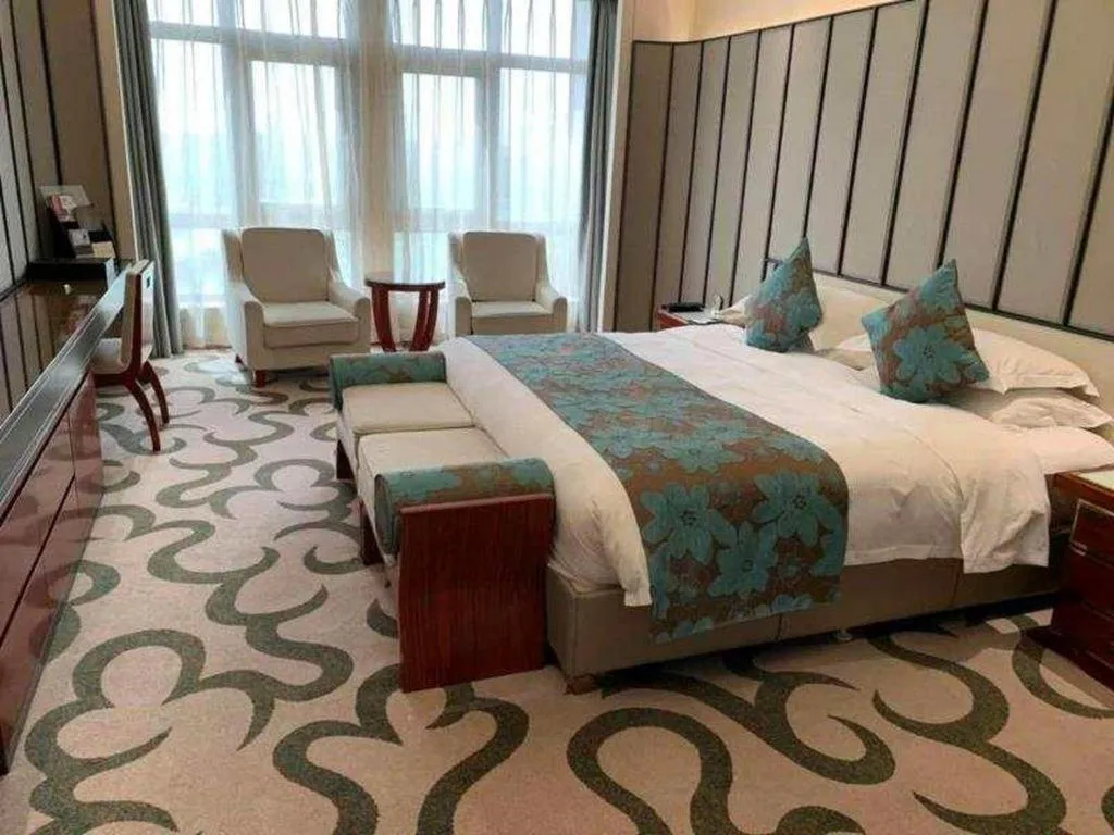 Bed in West International Trade Grand Hotel