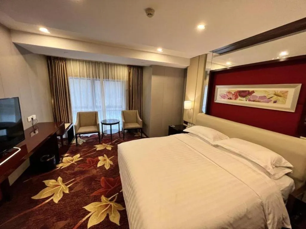 Bed in West International Trade Grand Hotel