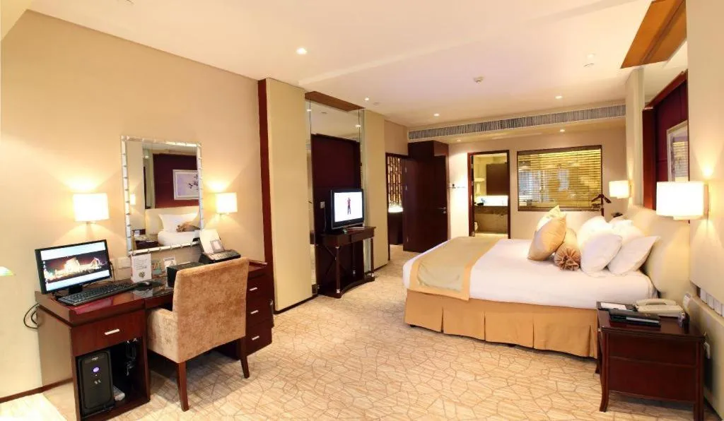 Bed in West International Trade Grand Hotel