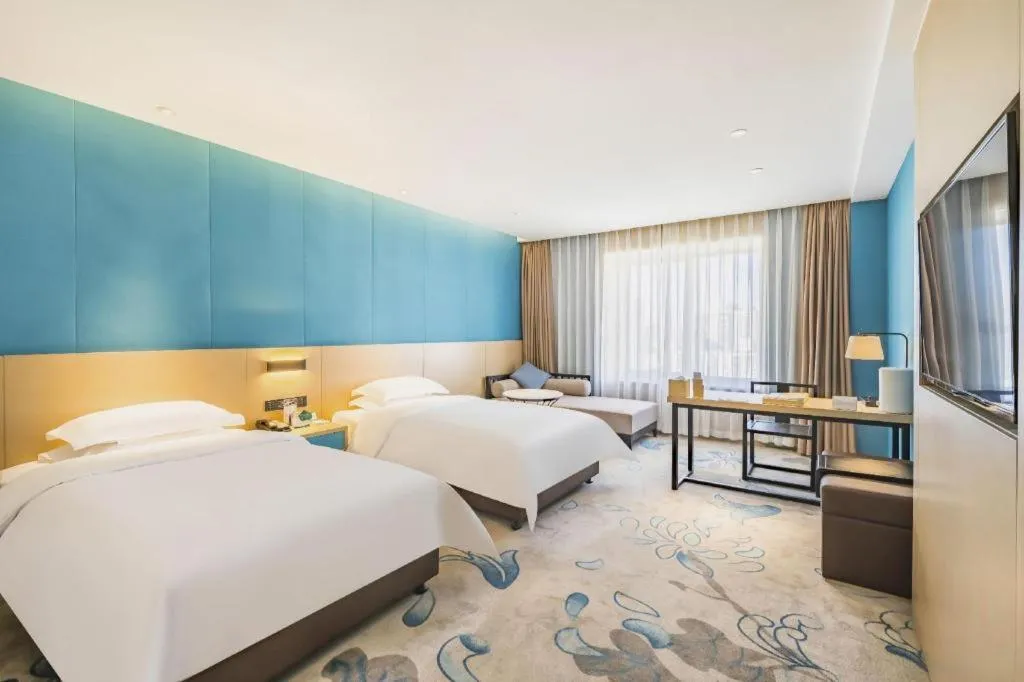 Bed in Beijing Ruyi Business Hotel