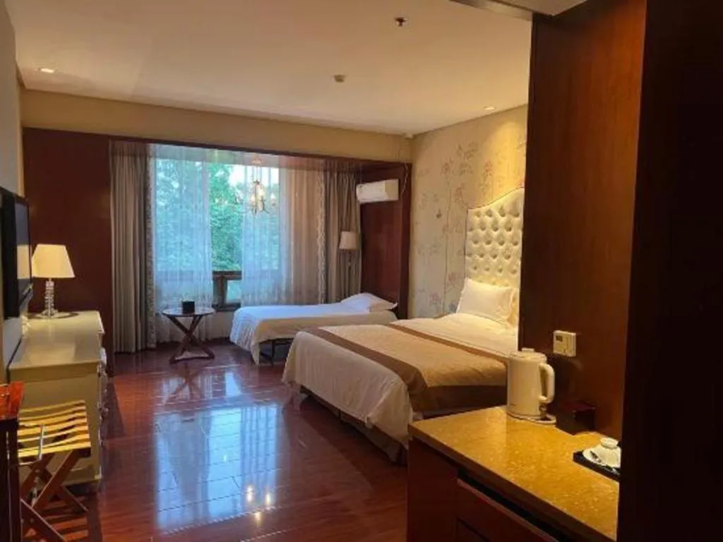 Bed in Yangzhou Hentique Huijin Resort Hotel