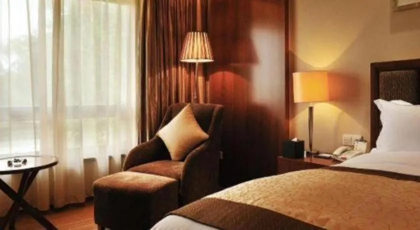 Bed in Yangzhou Hentique Huijin Resort Hotel