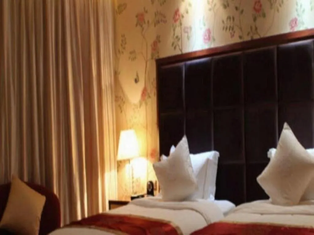 Bed in Yangzhou Hentique Huijin Resort Hotel