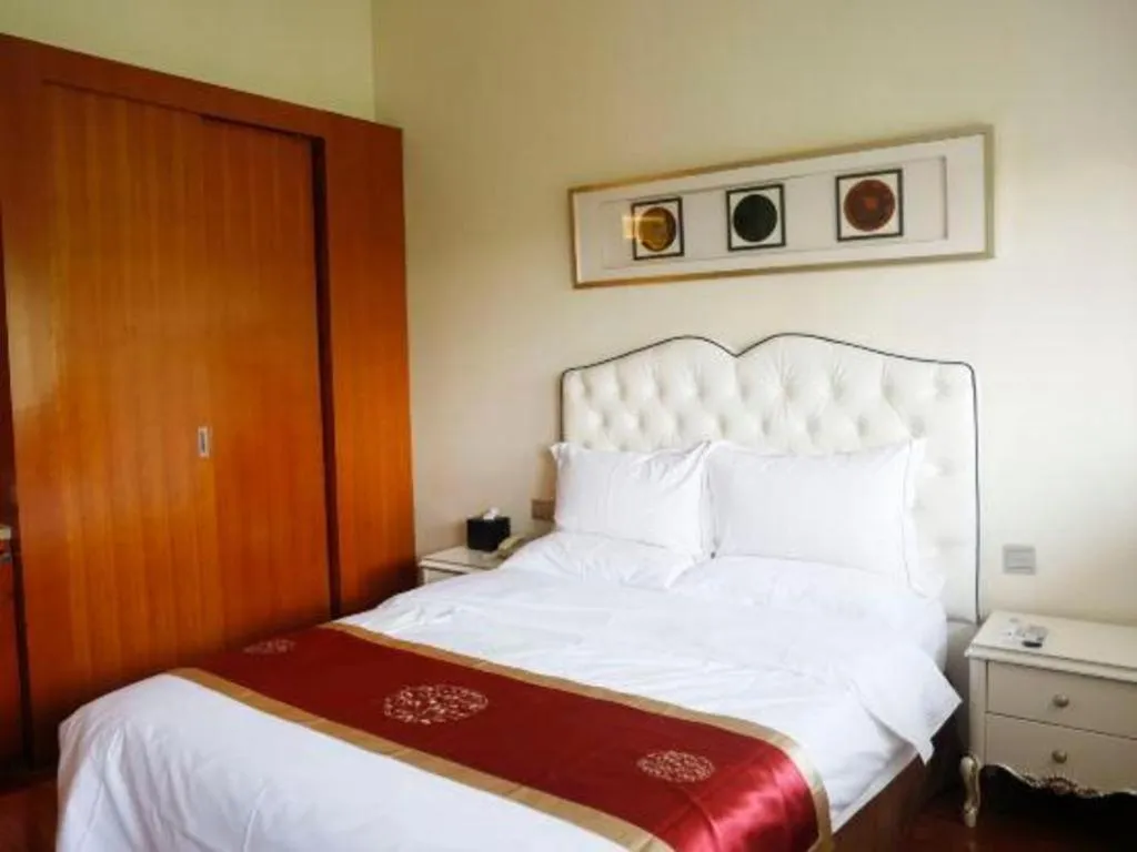 Bed in Yangzhou Hentique Huijin Resort Hotel