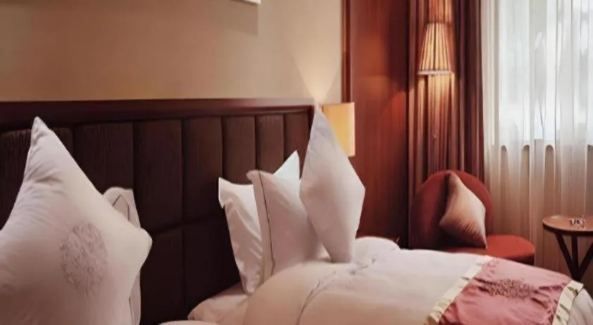 Bed in Yangzhou Hentique Huijin Resort Hotel