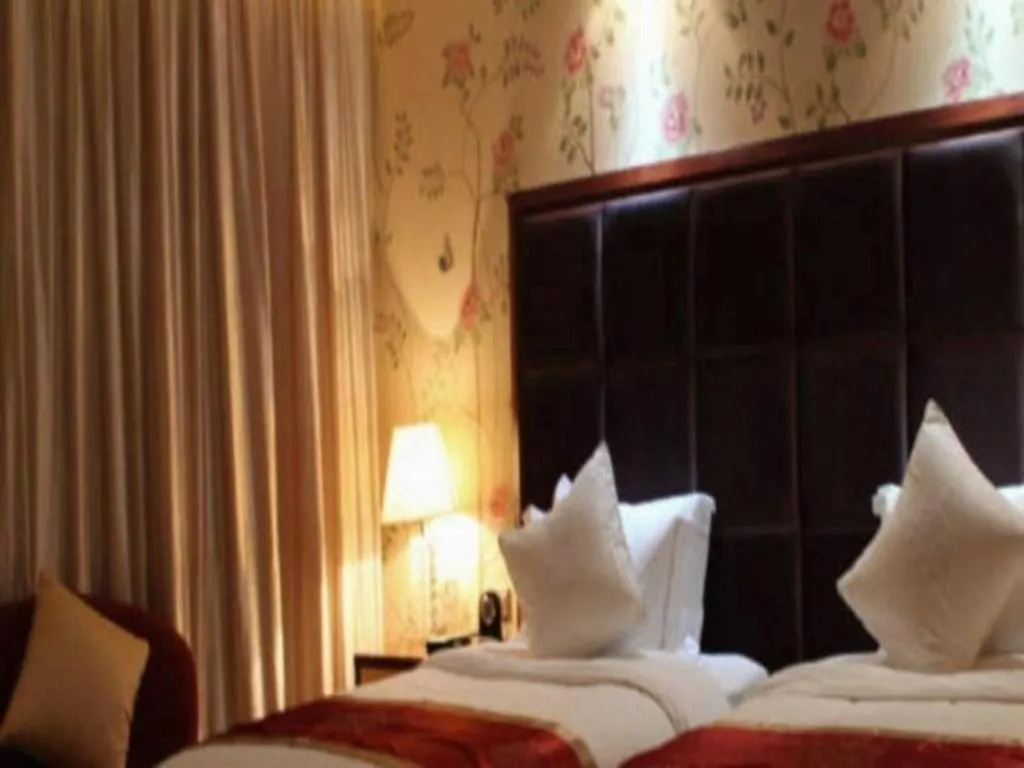 Bed in Yangzhou Hentique Huijin Resort Hotel