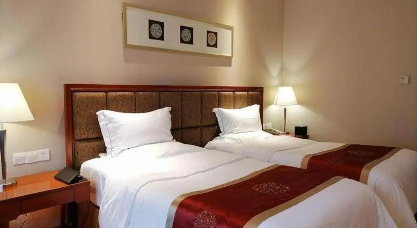 Bed in Yangzhou Hentique Huijin Resort Hotel