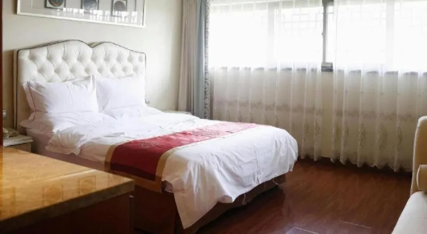 Bed in Yangzhou Hentique Huijin Resort Hotel