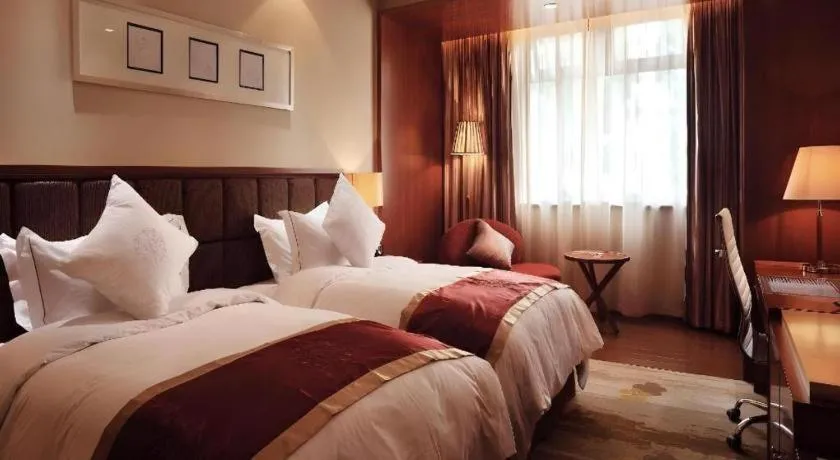 Bed in Yangzhou Hentique Huijin Resort Hotel