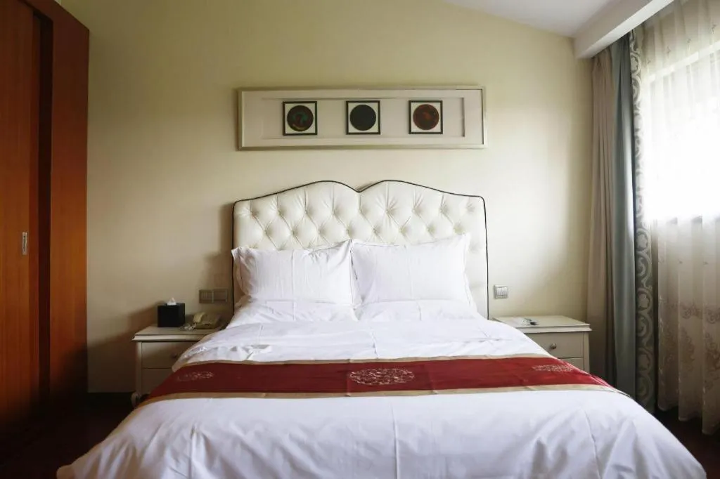 Bed in Yangzhou Hentique Huijin Resort Hotel