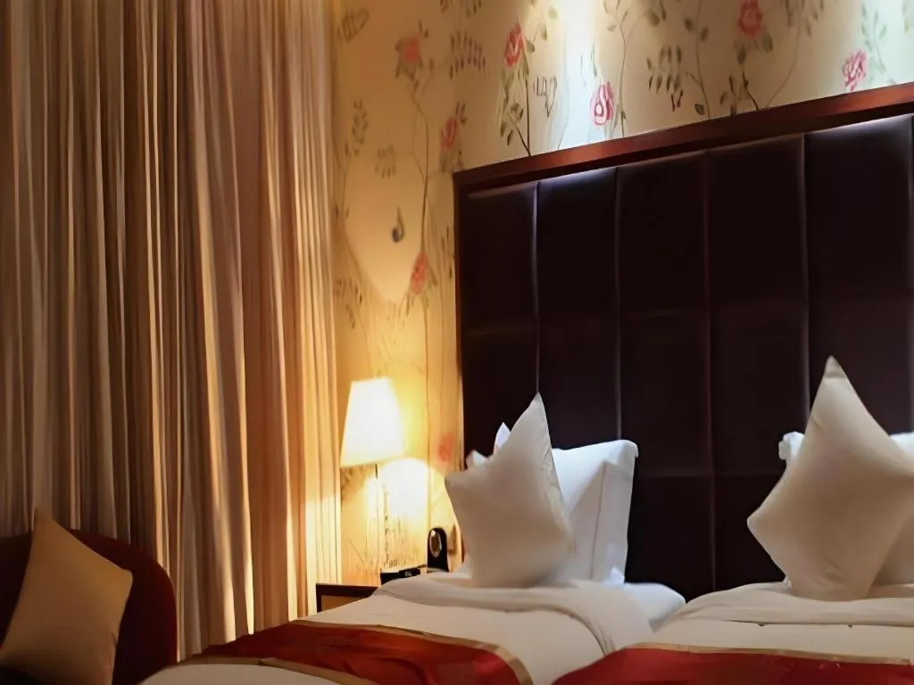 Bed in Yangzhou Hentique Huijin Resort Hotel