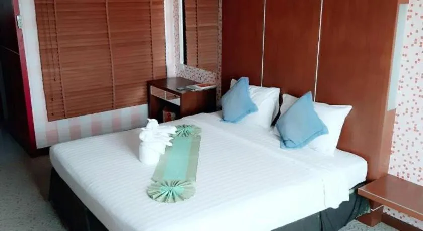 Bed in V-One Hotel Korat
