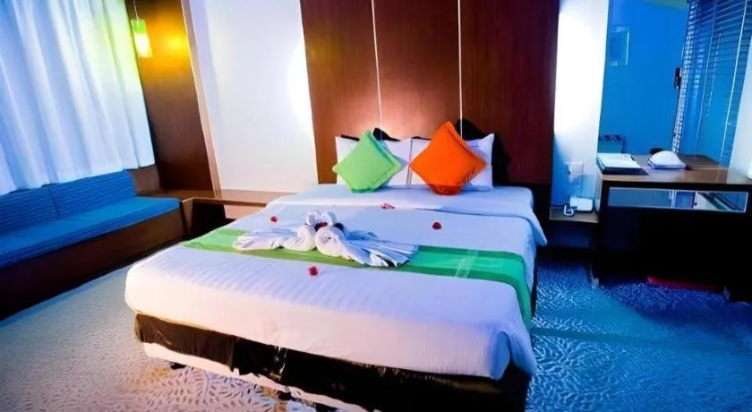 Bed in V-One Hotel Korat