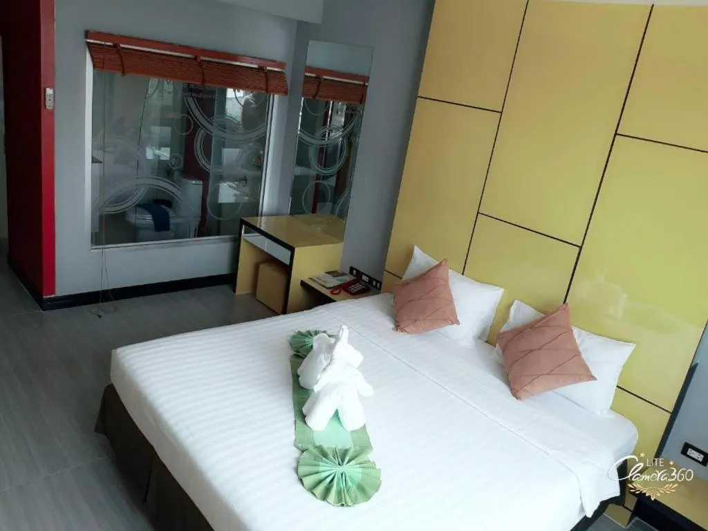 Bed in V-One Hotel Korat