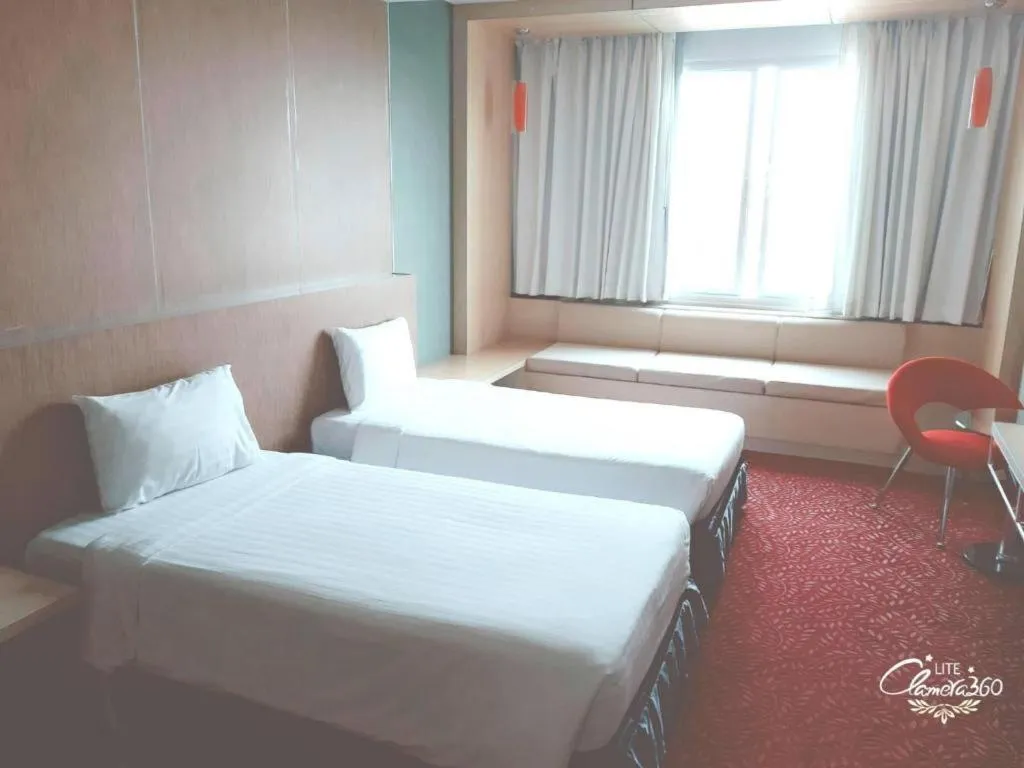 Bed in V-One Hotel Korat