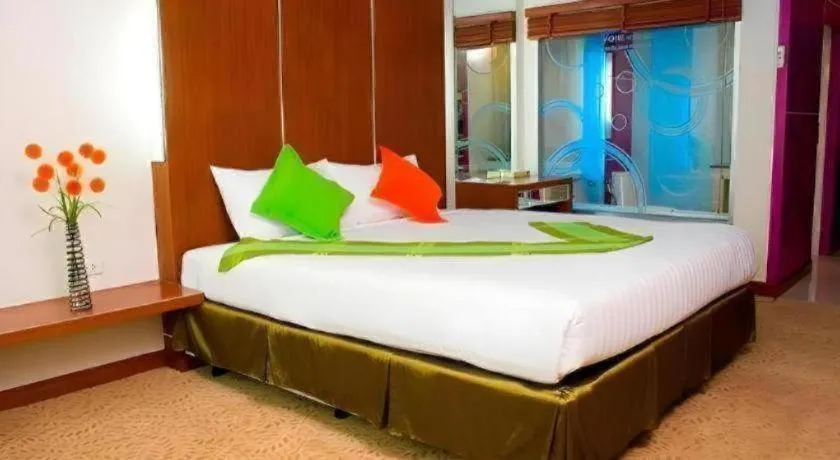 Bed in V-One Hotel Korat