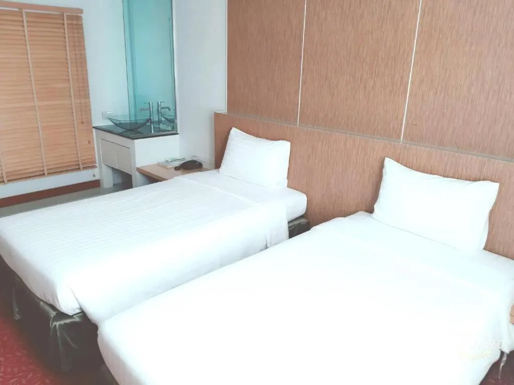 Bed in V-One Hotel Korat