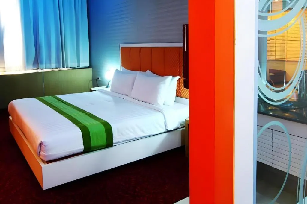 Bed in V-One Hotel Korat