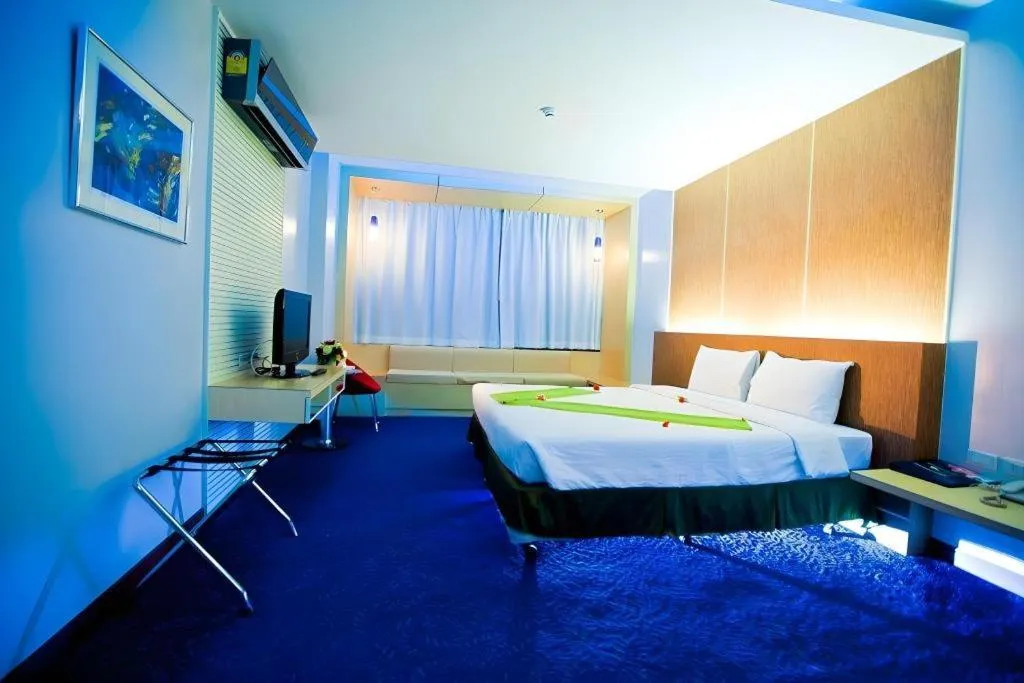 Bed in V-One Hotel Korat