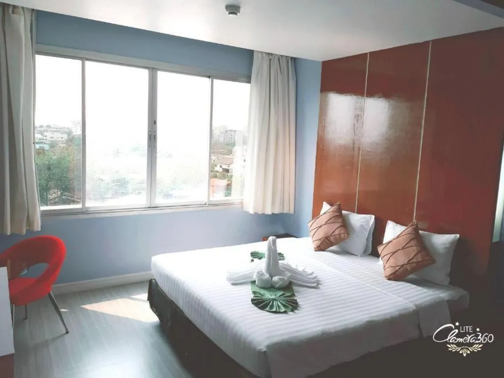 Bed in V-One Hotel Korat