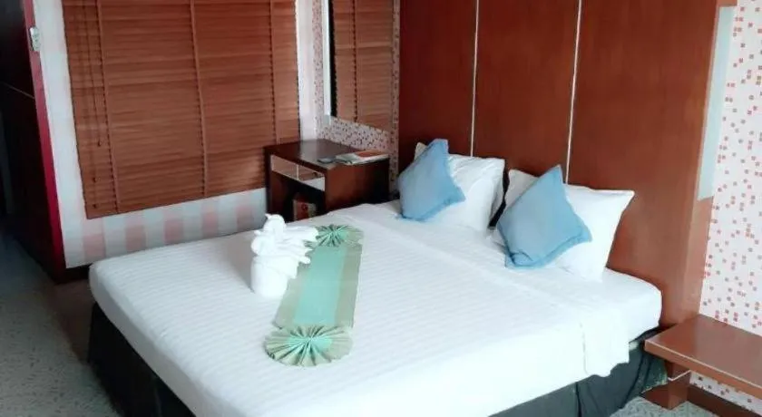 Bed in V-One Hotel Korat