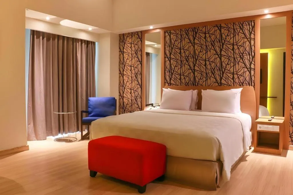 Bed in CLARO Makassar Hotel & Convention