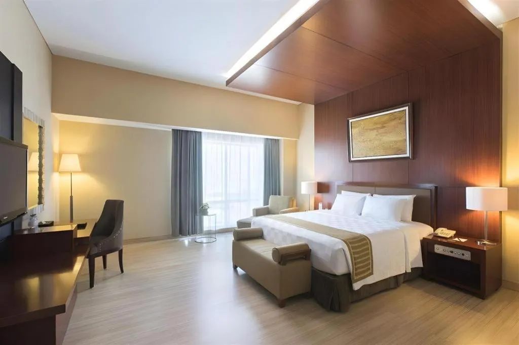Bed in CLARO Makassar Hotel & Convention