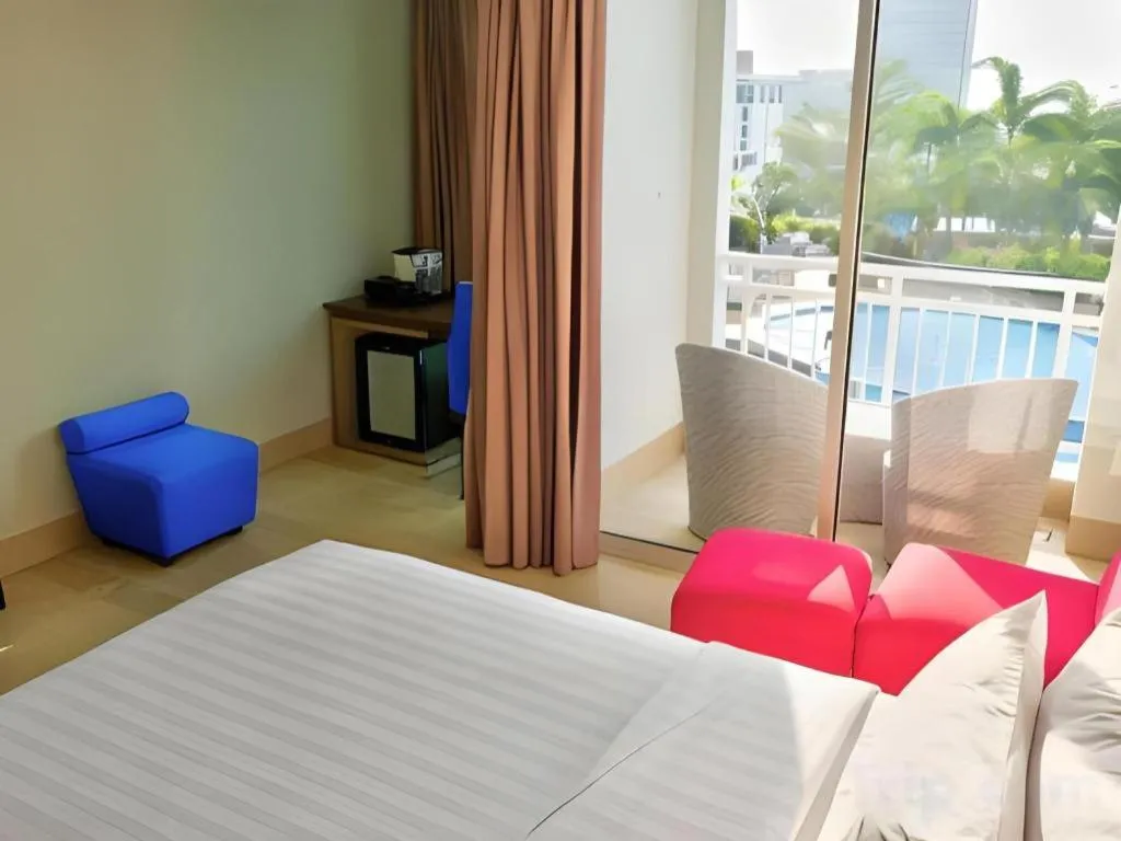 Bed in CLARO Makassar Hotel & Convention