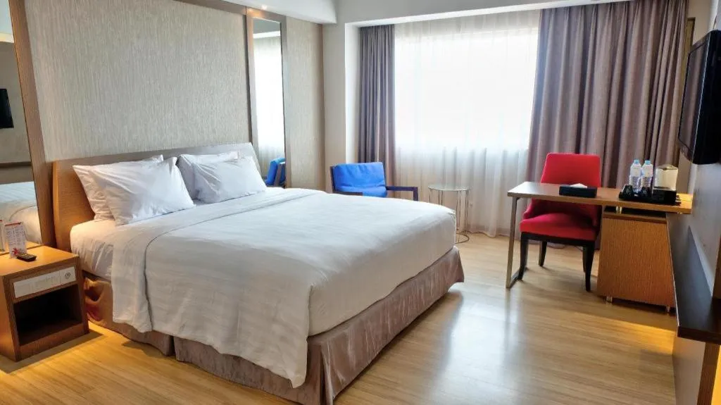 Bed in CLARO Makassar Hotel & Convention